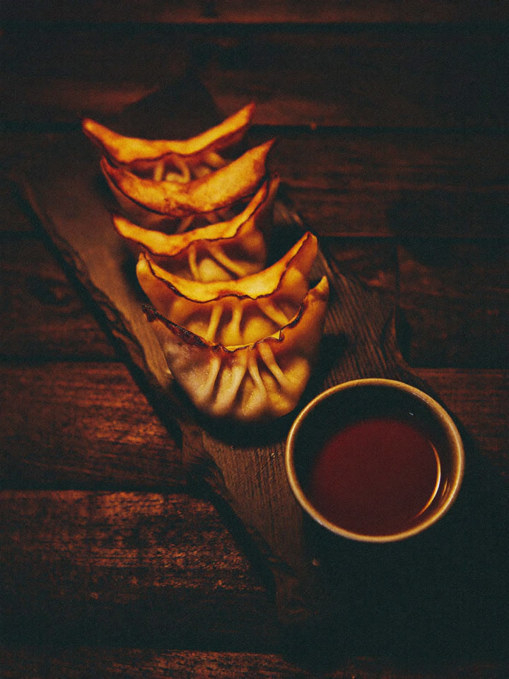 Pan-fried gyoza with dipping sauce